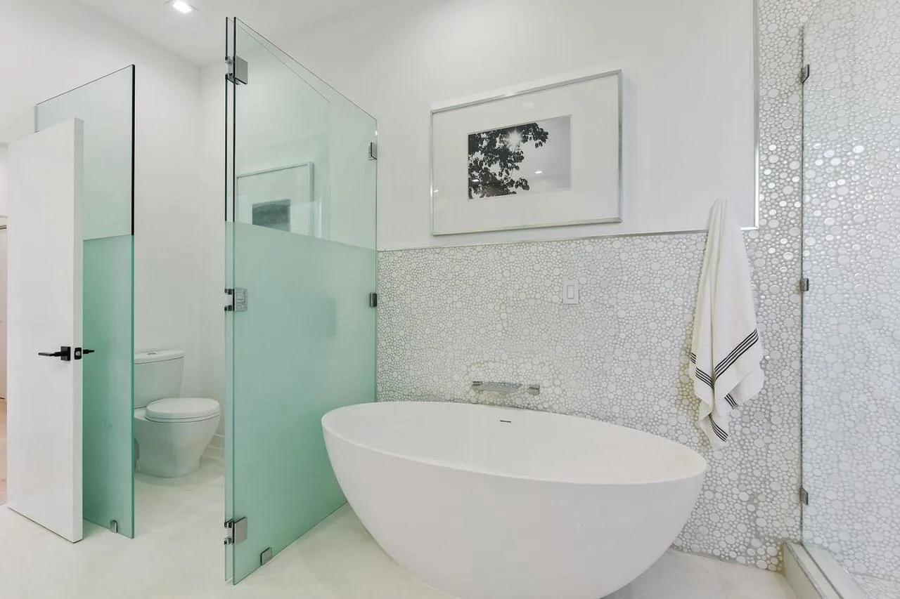 Freestanding tub and mosaic tile feature wall