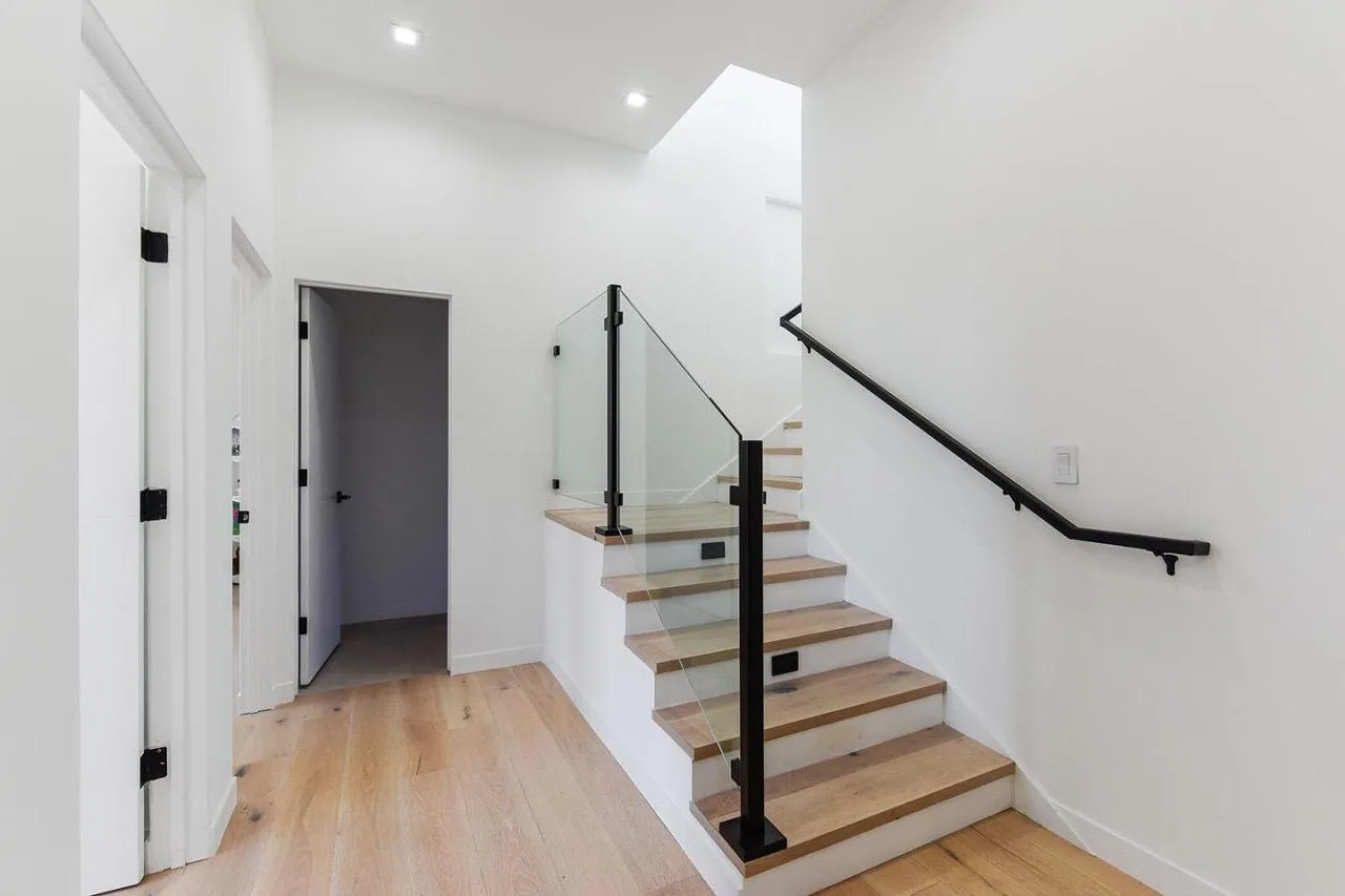 Wood stair treads with glass railing